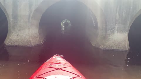 Kayaking thru tunnel on 4 mile river.