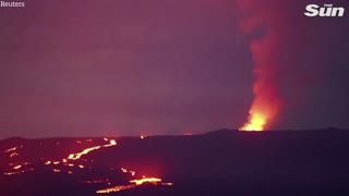 Fast-moving lava flows towards roads from Hawaii's Mauna Loa volcano