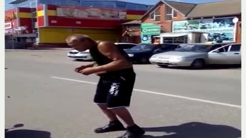 Drunk man dancing on the road
