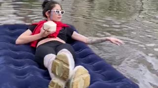 Relaxing on A Float Down A Flooded Street