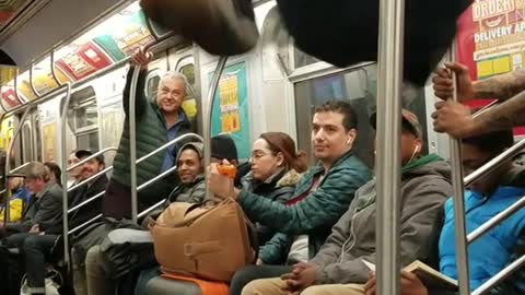 Subway dancers do hat flip tricks and spin around on poles