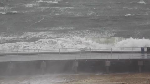 Giant waves crashing on the bridge