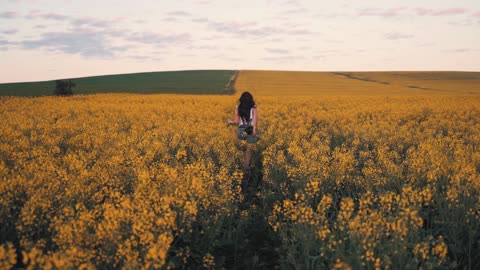 video woman running on the flower field