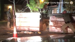 Bear gets help after getting stuck in dumpster