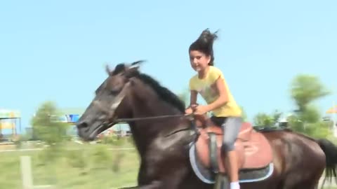 Beautiful girl's talent riding on horse