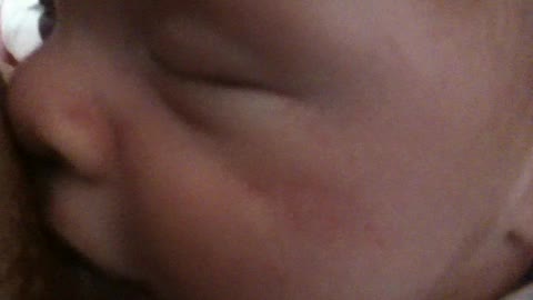 One month old boy enjoyed breastfeeding