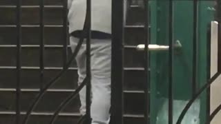 Grey hoodie guy practices walking up stairs in subway