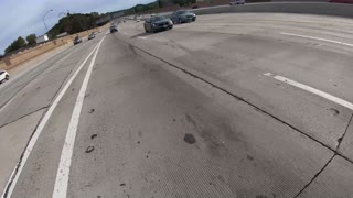 Motorcyclist Helps Dead Car on Busy Interstate in California