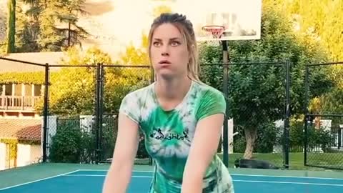 Beautiful girl playing basketball.