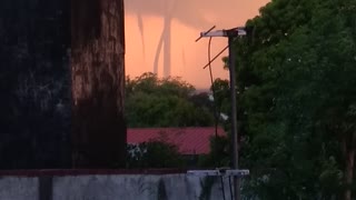 Multiple Waterspouts Wind Down From Sky During Storm