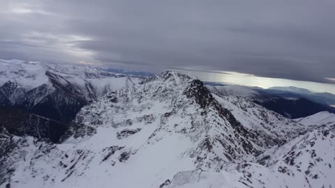 BASE jumping from atop a frozen mountain