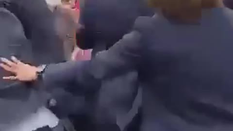 A journalist attempt to slap the french president