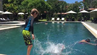 Kid tries to push brother in pool but it backfires