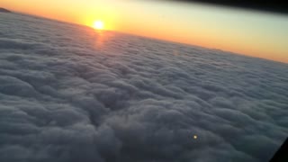 Clouds and sunset from a plane