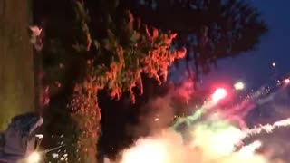 Man lights up fireworks attached to his hands, shoots into the sky