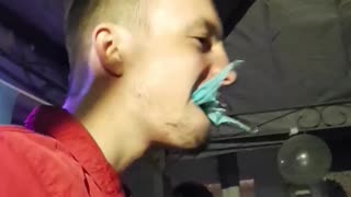 Man eats plastic banner