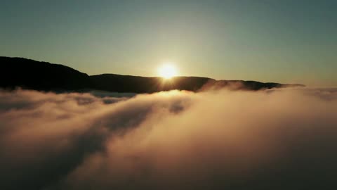 Drone Captures Amazing Footage Of Sunrise From Above The Clouds