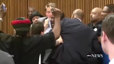 Dad Jumps Over Table To Attack Daughter's Killer in Court