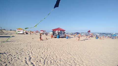 Romildo trying to make a giant homemade kite fly