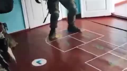 Ukraine soldier plays hopscotch inside children's school