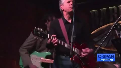 US Secretary of State Antony Blinken sings and plays guitar with a band at a bar in Kiev