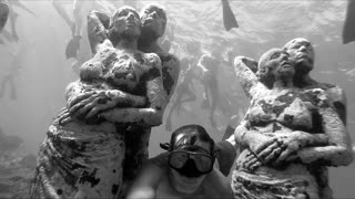 Crowds Swim to Underwater Statues