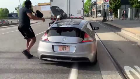 Dummy Protestor INSTANTLY Regrets Trying to Block Moving Vehicle