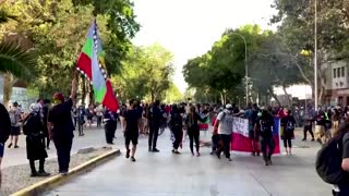 Tear gas and water cannon fly in Chile protest