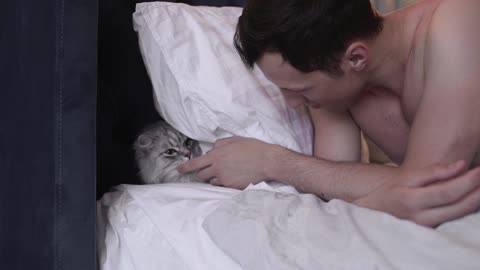 man showing love for his cat