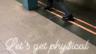 Guy in suit uses briefcase as arm weights