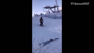 Black helmet snow ramp skiing backflip faceplant