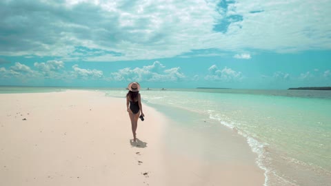 A Woman Walking in the Shore Island