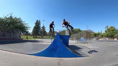 Guys Do A Duo Backflip Jump On Bmx