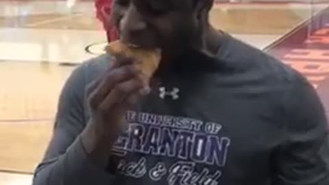 Dude crushes entire slice of pizza in one bite