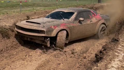 Dodge Challenger riding through mud