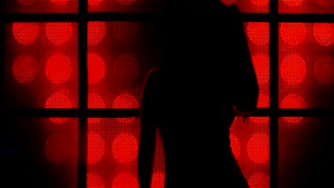 Silhouette of a girl dancing at a nightclub