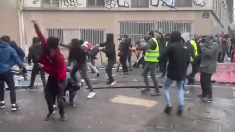 COMING TO USA: Kurds smashing up roads & throwing it at police as they riot in Paris on Xmas Eve.