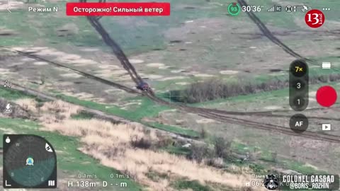 An image of a Russian tank fleeing the battlefield under artillery fire