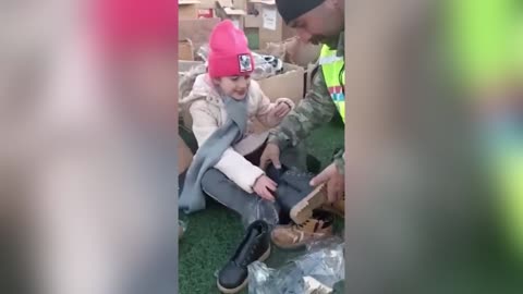 Little Girl Receives Boots From Emergency Workers To Keep Warm