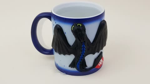 Magic mug Toothless Energy blue from How to Train Your Dragon. Night fury on a chameleon cup