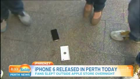 First person to buy iPhone 6 drops it on camera