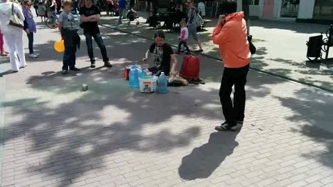 Street artist playing 'drums' !