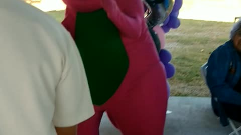 Purple dinosaur sings and dances to happy and know it at birthday party at city ranch venue Houston