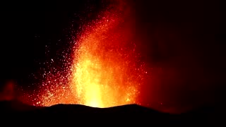 La Palma volcano spews red-hot lava