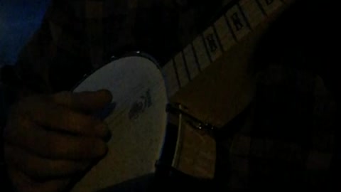 Playing banjo at dusk