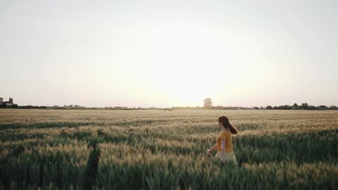 Girl walking in beautiful fields FHD