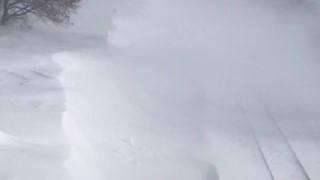 Train Travels Through Massive Snow Drift
