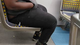 Man grey shirt black pants stretching