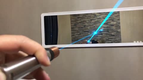 Video showing the brilliance of a beam from a laser pointer both departing and returning