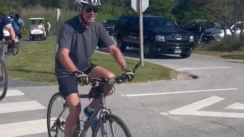 WATCH: Joe Biden falls down on bicycle